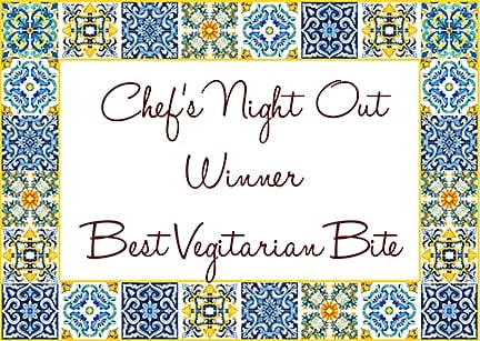 Card framed in painted tiles reading: Chef's Night Out Winner, Best Vegetarian Bite