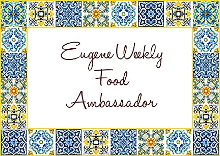 Card framed in painted tiles reading: Eugene Weekly Food Ambassador